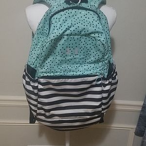 A Under Armour  book bag  that  has  dots